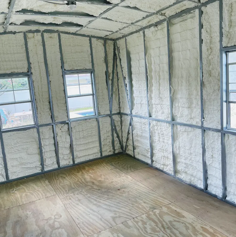 Closed-cell spray foam insulation applied to wall cavities in a residential project in Country Club